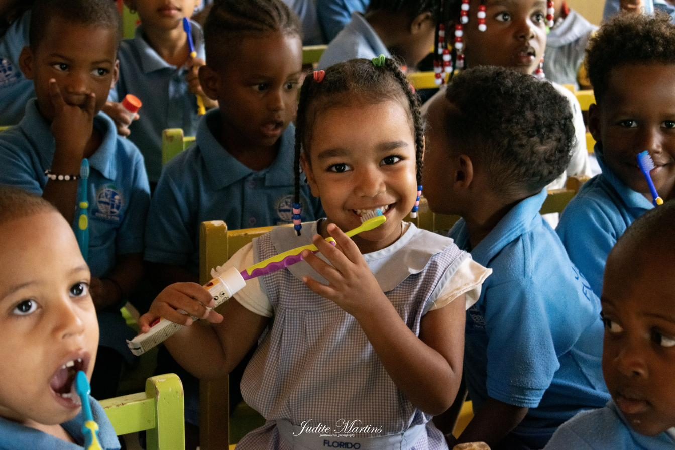 Child brushing teeth during an oral health action in Cape Verde