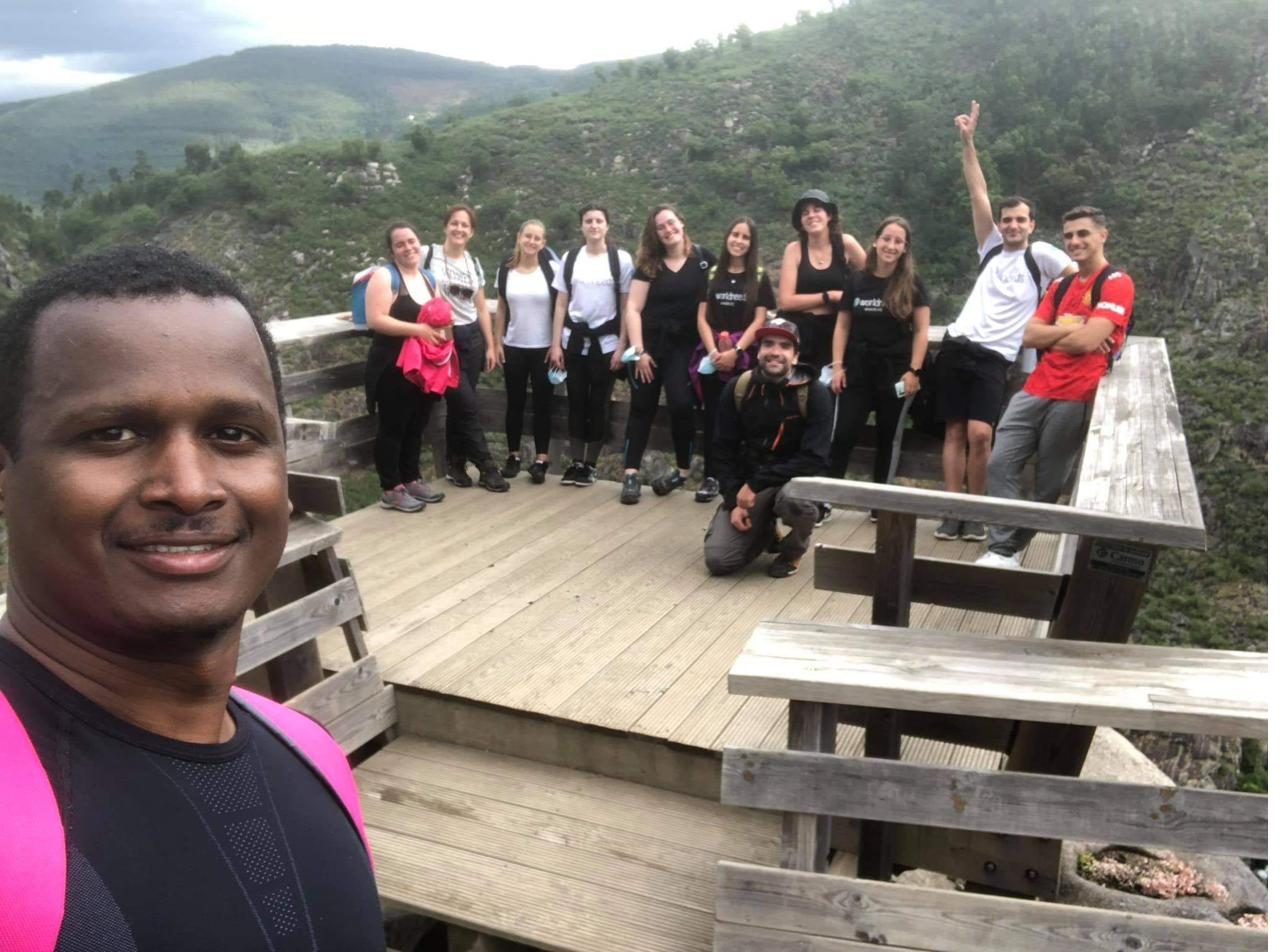 Group of World Needs volunteers at a viewpoint, during a team hike